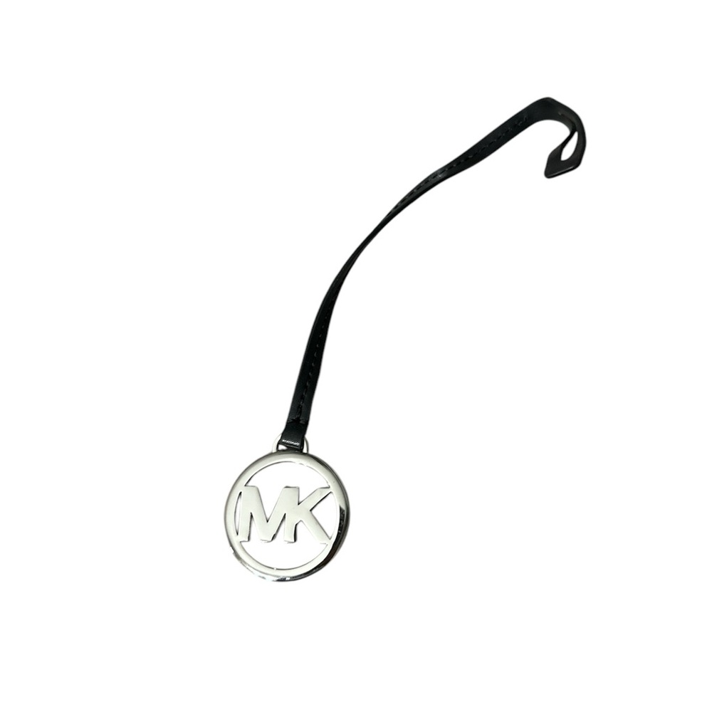 Michael Kors Silver and Black charm brand new never used nice